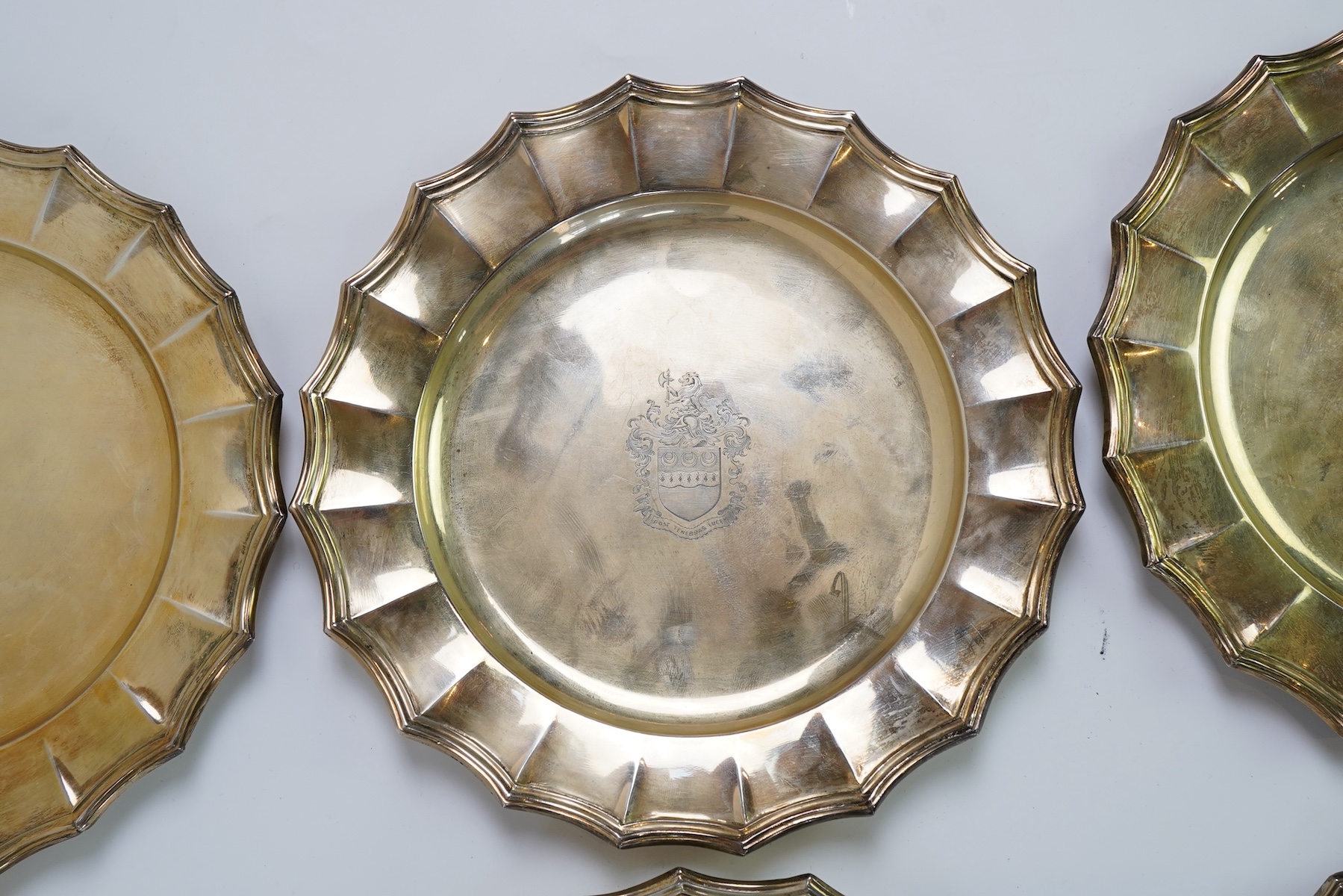 A set of twelve George V silver gilt side plates by J.S. Harman & Co